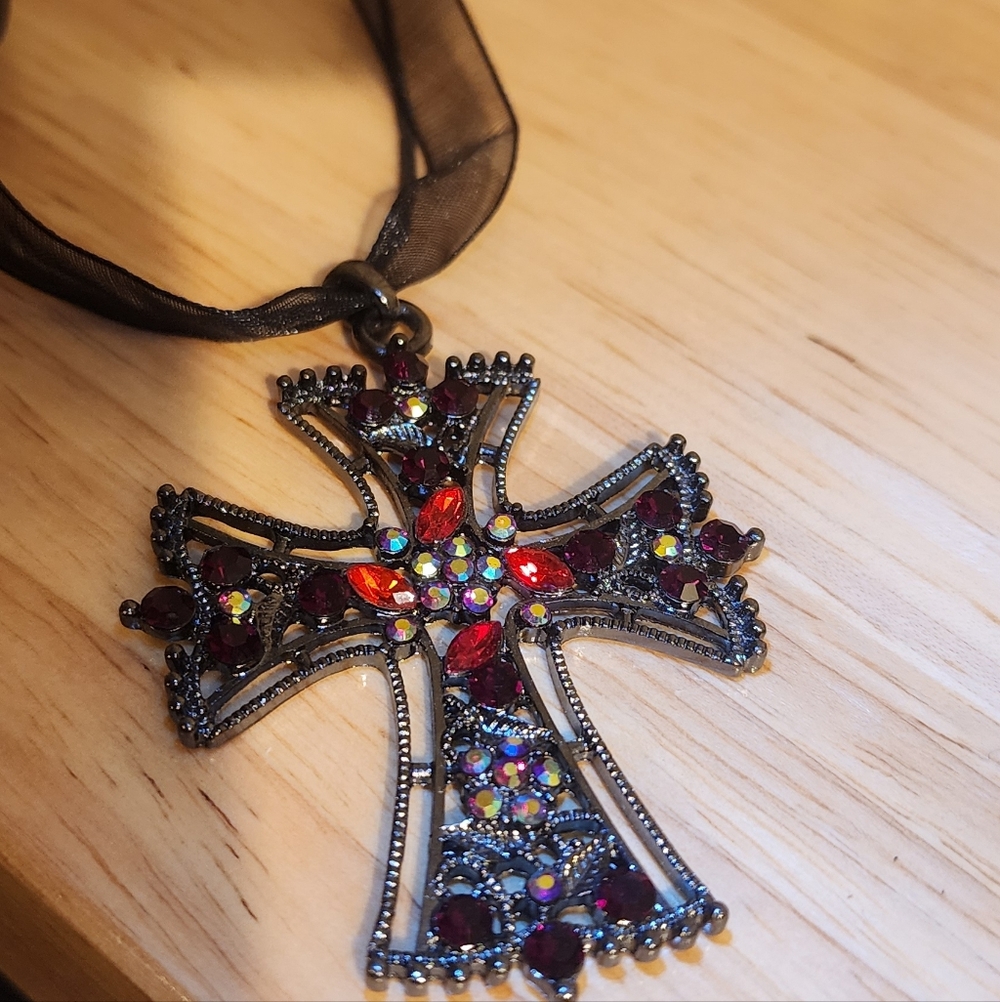 Gothic-style cross pendant necklace black ribbon.